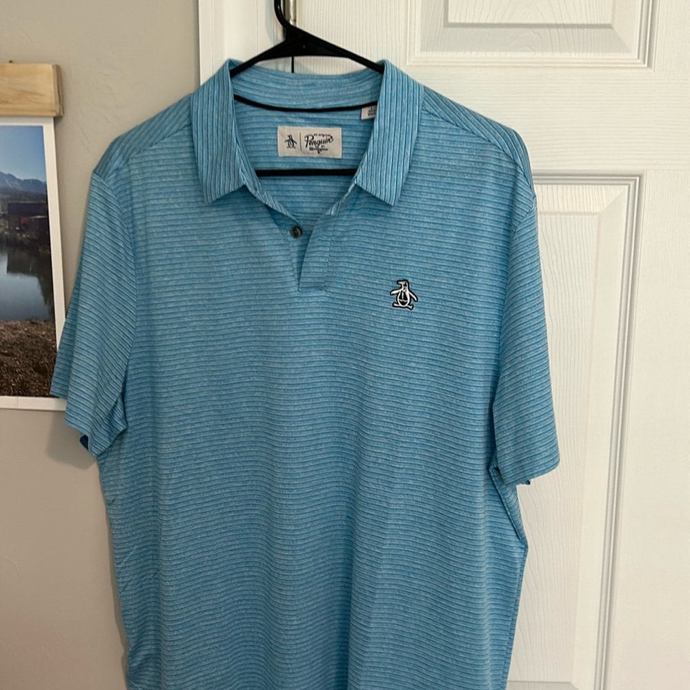 Men’s Original Penguin Performance shirt Size L. Lt Blue color. 100% polyester.